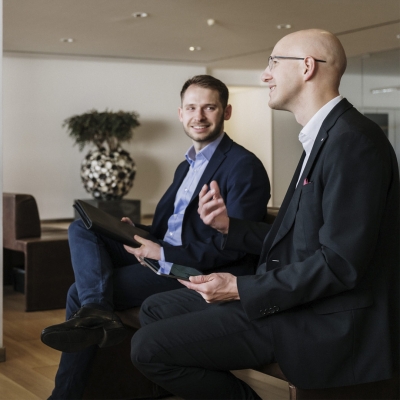Two men are talking to each other.